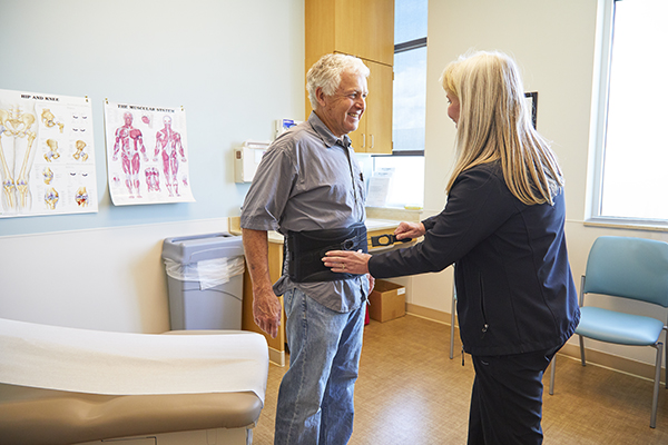 Healthcare provider working with medical equipment